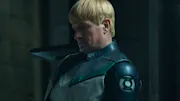 Guy Gardner sitting in the shadows, looking serious