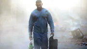 John Stewart, holding the Lantern, walking towards us through the smoke